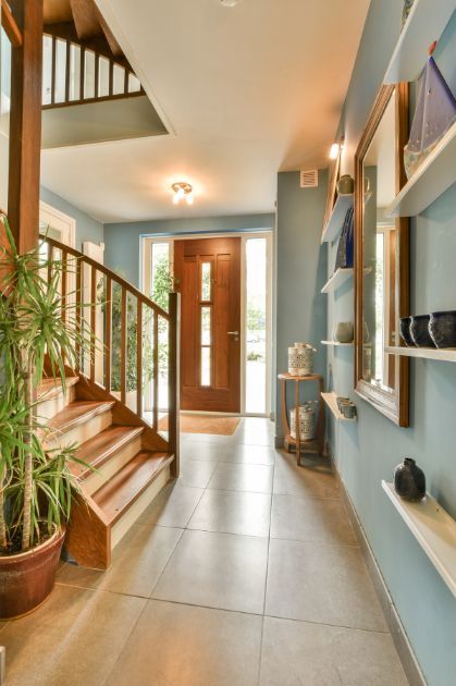 view of the entryway from inside of a home with a staircase on the left