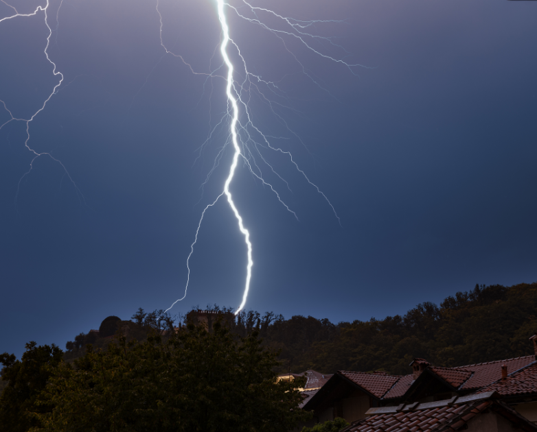 lightning strike behind homes
