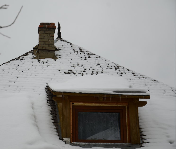 snow building on roof