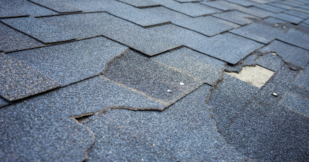 A roof with missing or damaged shingles.