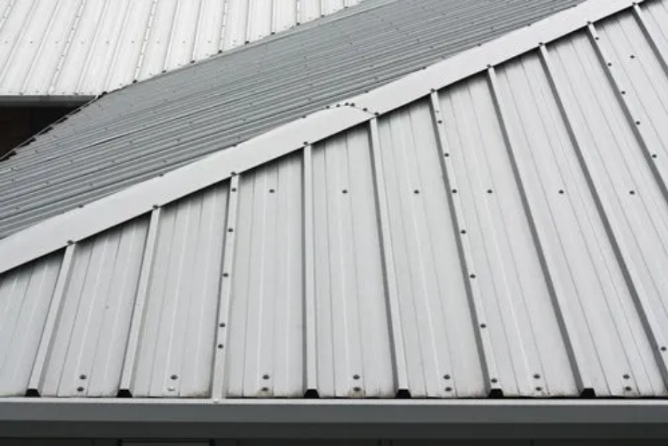 image of a grey exposed fastener metal roof.