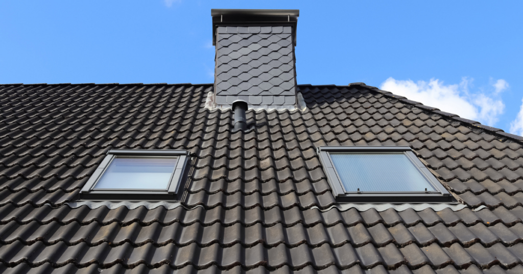 2 roof windows or skylights seen from the exterior of the home on the roof.
