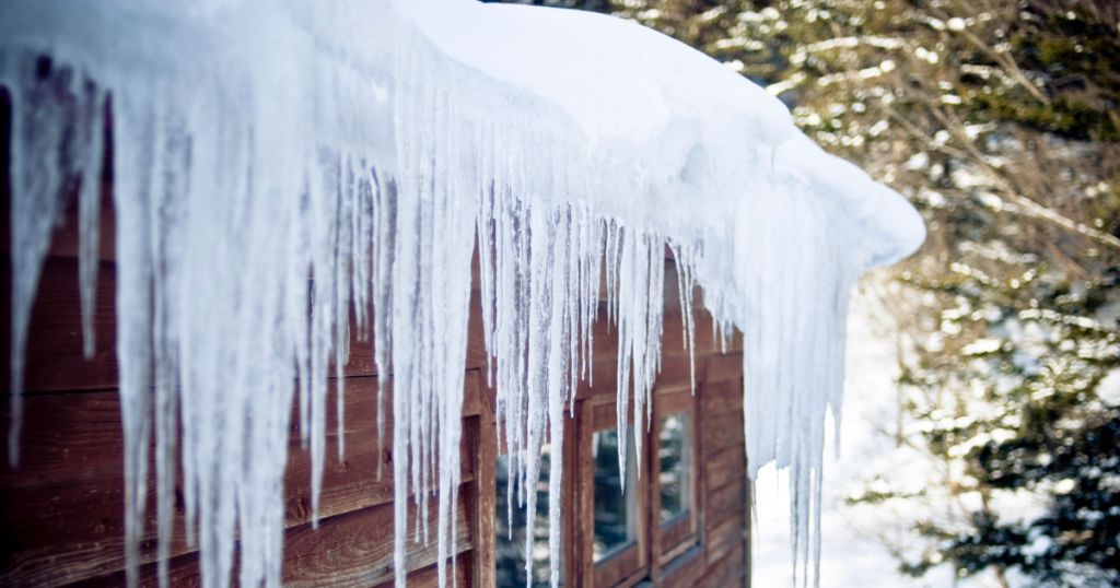 ice dams and icicles hanging from roof