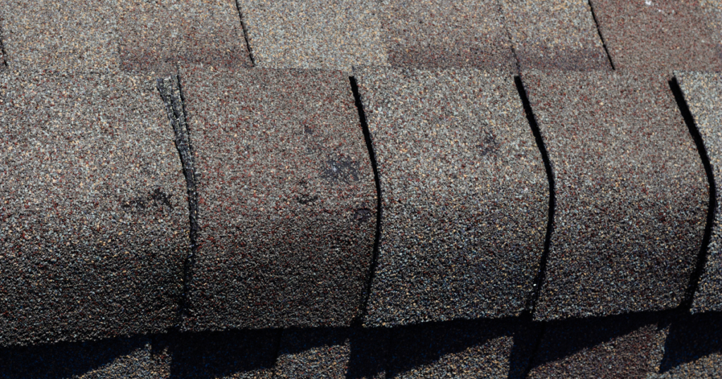 Small, granule loss caused by hail on an asphalt roof.