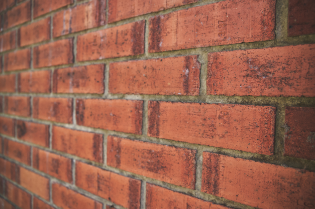 A close up of brick siding on a building