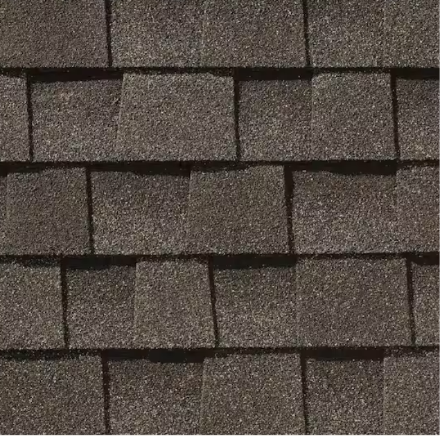 close up image of GAF architectural shingles in the color weathered wood.
