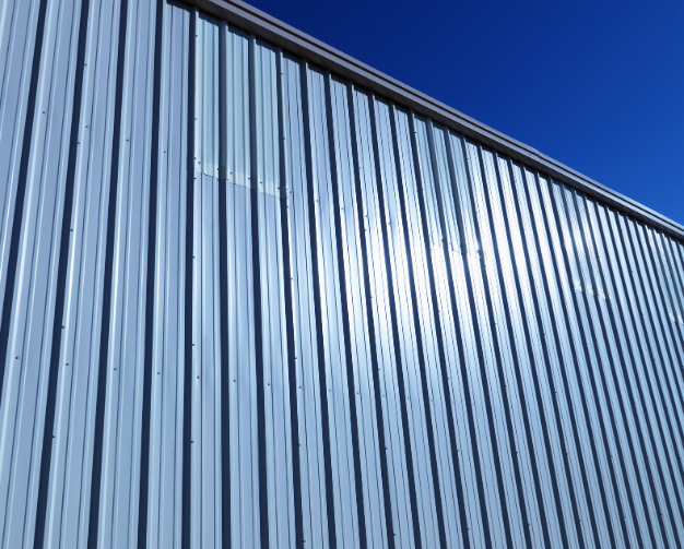 An upward shot of metal siding on a building