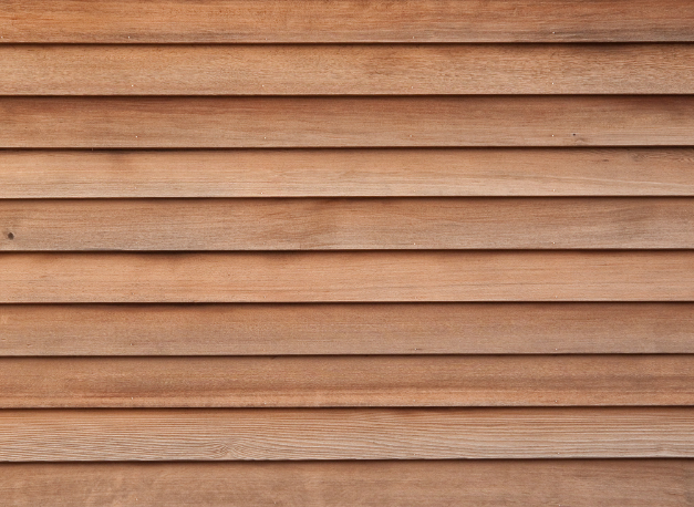 A close up of wood siding on a building