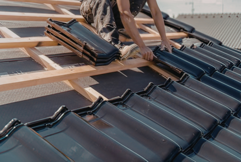 zinc metal roof panels being installed